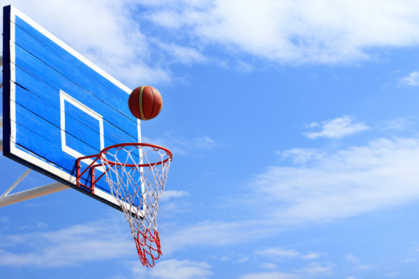 Basketball hoop against a blue sky