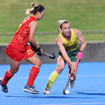 Jane Claxton in action in an international hockey match
